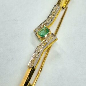 Złota broszka ze szmaragdem i diamentami